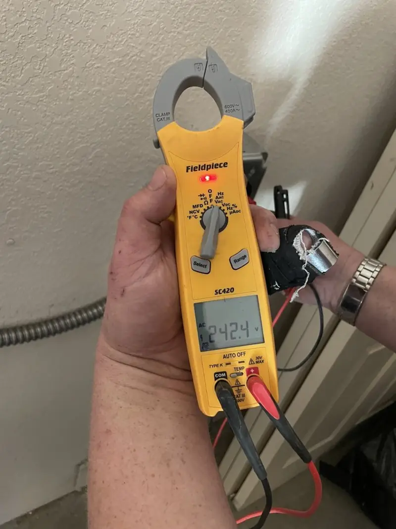 Voltage testing with clamp meter during Ceiling Fan Installation in Lake City